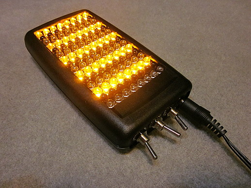 LED light therapy unit showing yellow light